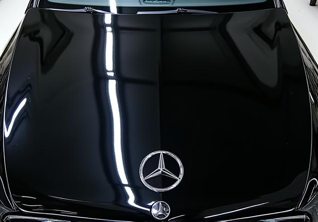 The same black Mercedes-Benz S-Class hood, now a perfect mirror-like finish with no swirl marks.
